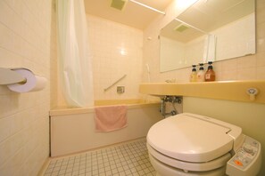 Combined shower/tub, free toiletries, hair dryer, slippers