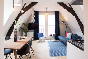 Apartment, 1 Bedroom | Living room | Flat-screen TV
