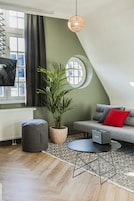 Appartement, 1 slaapkamer | Woonkamer | Een flatscreentelevisie