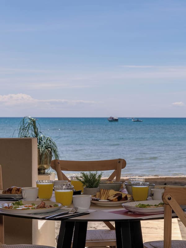 Breakfast, lunch, dinner served; beach views