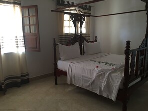 Classic Double Room, 1 Queen Bed, Private Bathroom, Ground Floor | 2 bedrooms, desk, iron/ironing board, free WiFi - Bazi's House (Bwejuu)