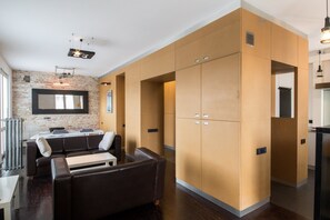 A modern kitchen with built-in cabinets and a central island.