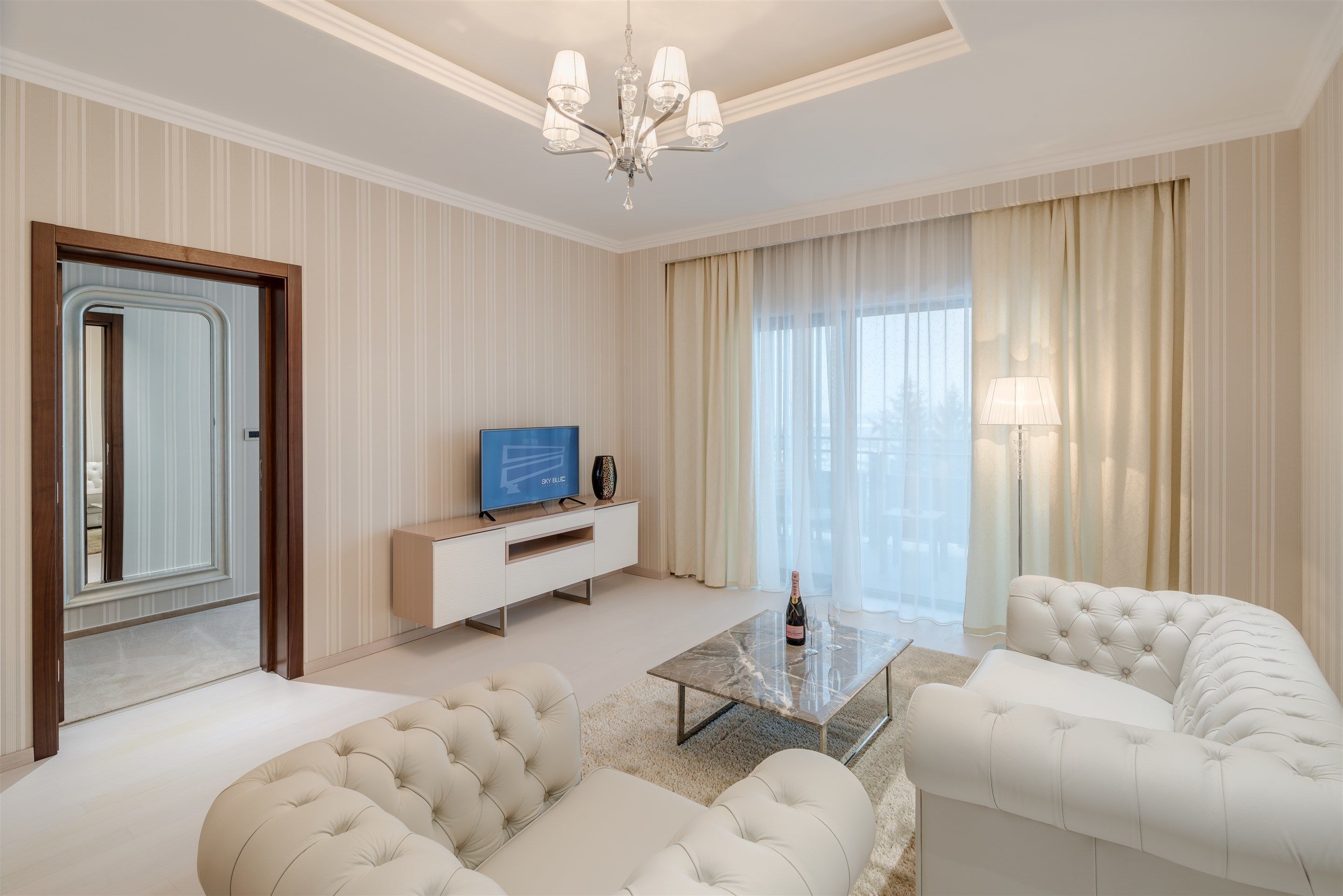 suite, 1 bedroom, balcony, pool view | living room | smart tv, books