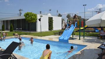 Relax by the pool, where kids can play on the slide and enjoy the picnic area.