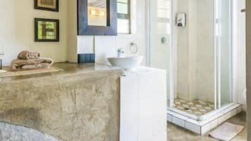 Deep-soaking bathtub, rainfall showerhead, free toiletries, hair dryer