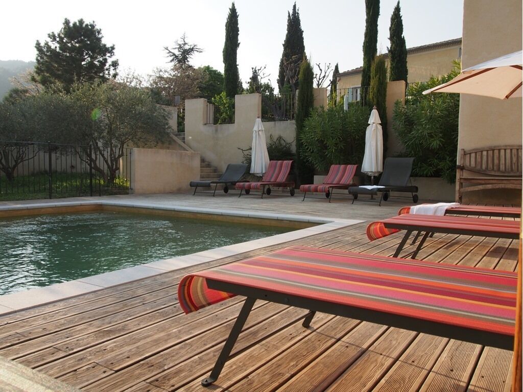 Outdoor pool, a heated pool, open 9:00 AM to 8:00 PM, pool umbrellas
