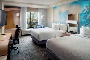 Colchones con pillow-top y caja de seguridad en la habitación