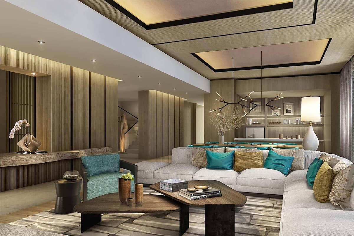A modern living room with a sofa, coffee table, and decorative elements.