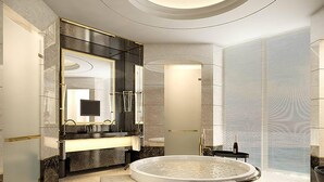 A modern bathroom with a large bathtub, a double sink vanity, and a large mirror. - Renaissance Suzhou Taihu Lake Hotel (Suzhou)