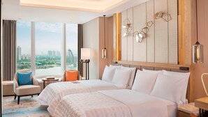 A hotel room with two beds, a view of the city, a modern chandelier, and a large window with curtains. - Le Meridien Xi'an Chanba (Xi'an)