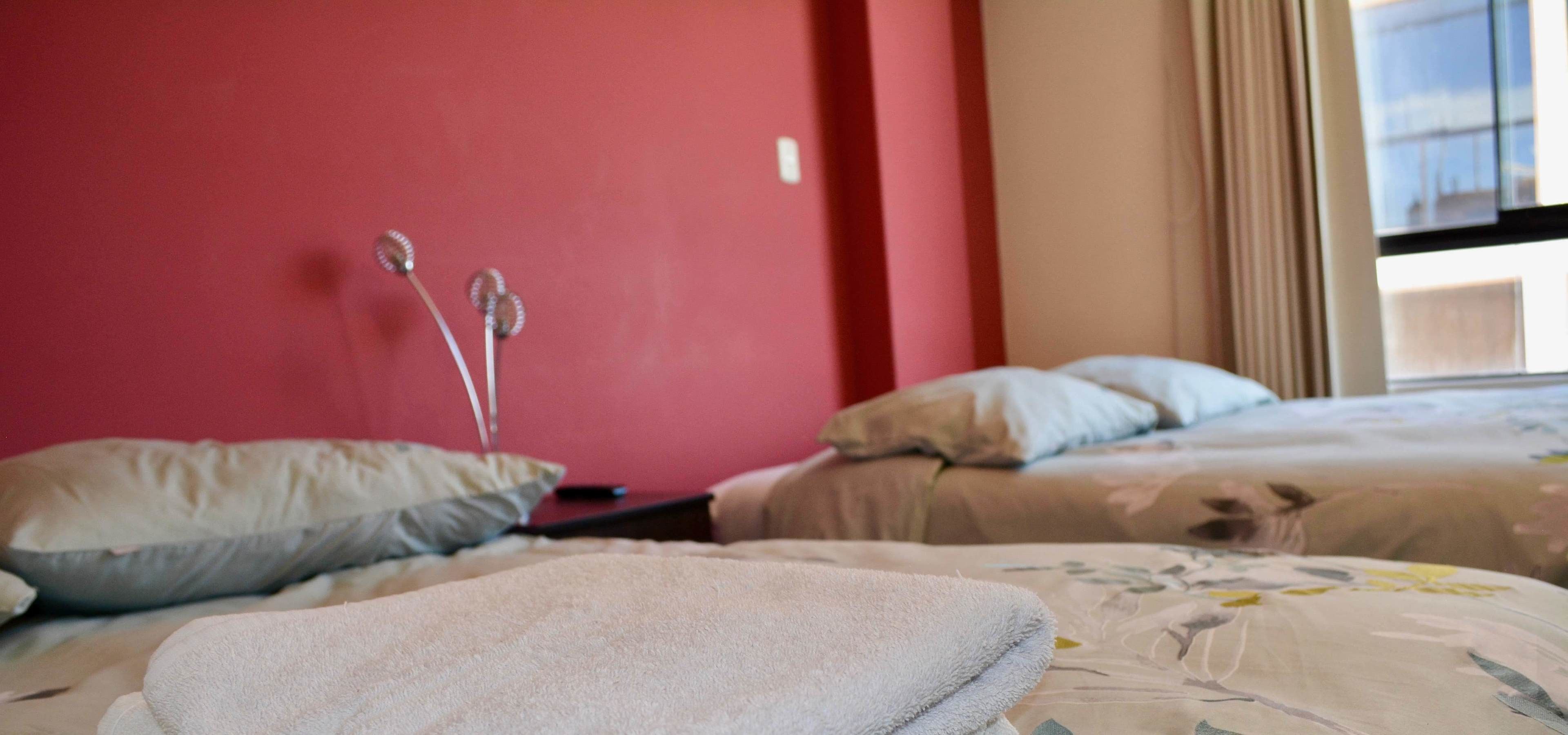 twin room, 2 queen beds, shared bathroom | iron/ironing board, free wifi, bed sheets