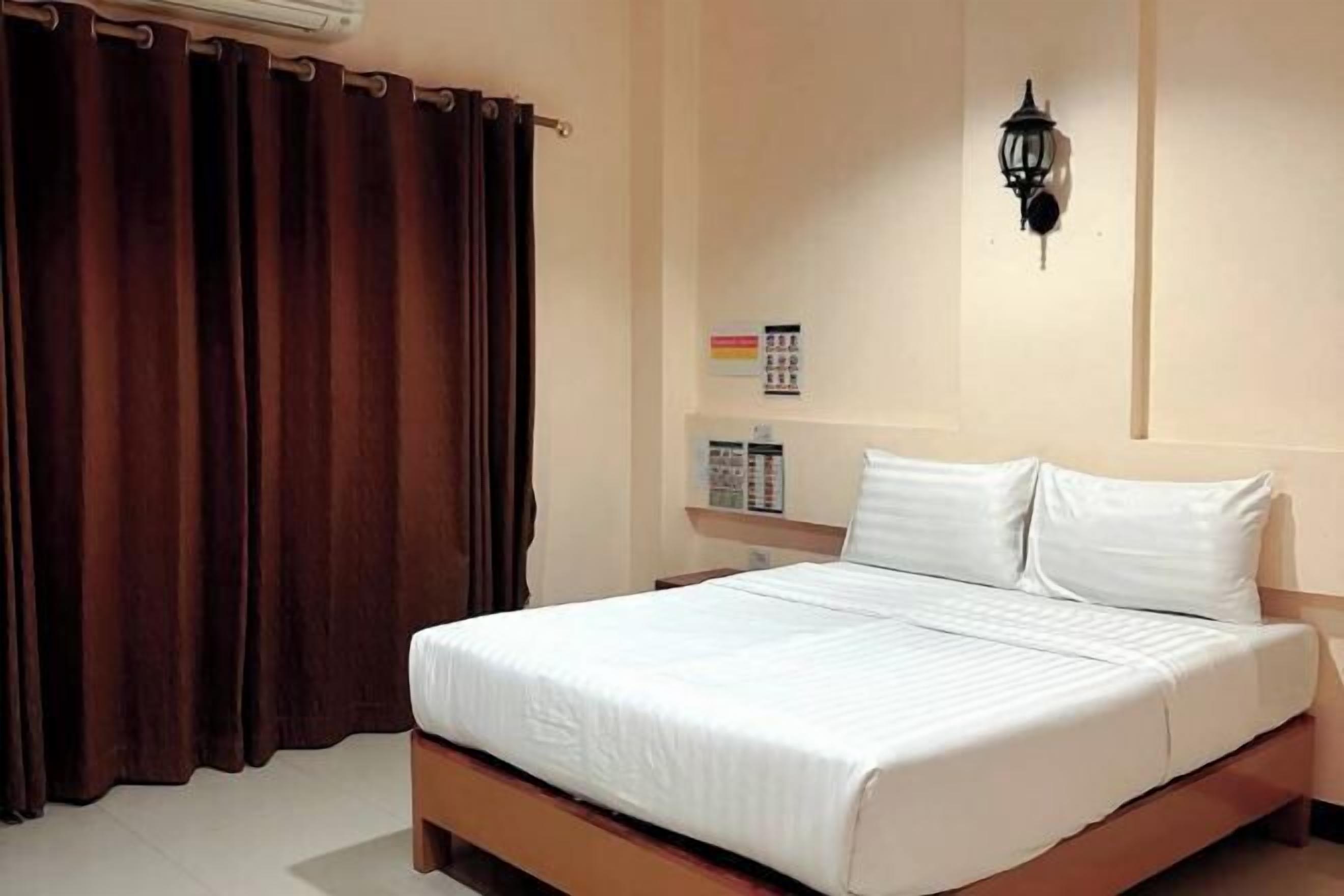 Desk, blackout curtains, free WiFi, bed sheets