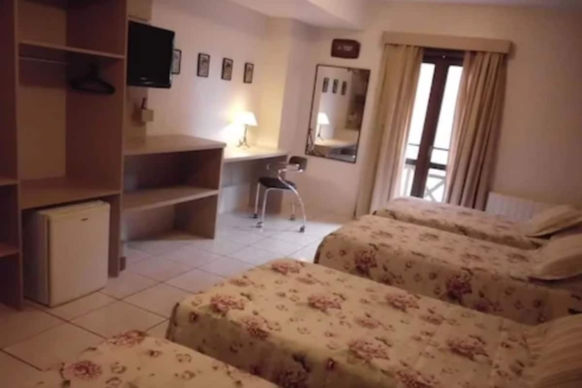 Quadruple Room | Minibar, in-room safe, desk, free cots/infant beds