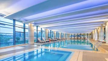 Indoor pool, open 7:00 AM to 11:00 PM, pool loungers, lifeguards on site