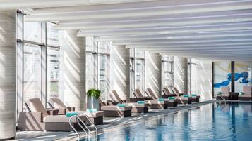 Indoor pool, open 7:00 AM to 10:30 PM, pool loungers, lifeguards on site