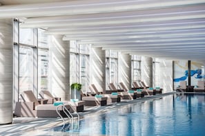 Indoor pool, open 7:00 AM to 10:30 PM, pool loungers, lifeguards on site