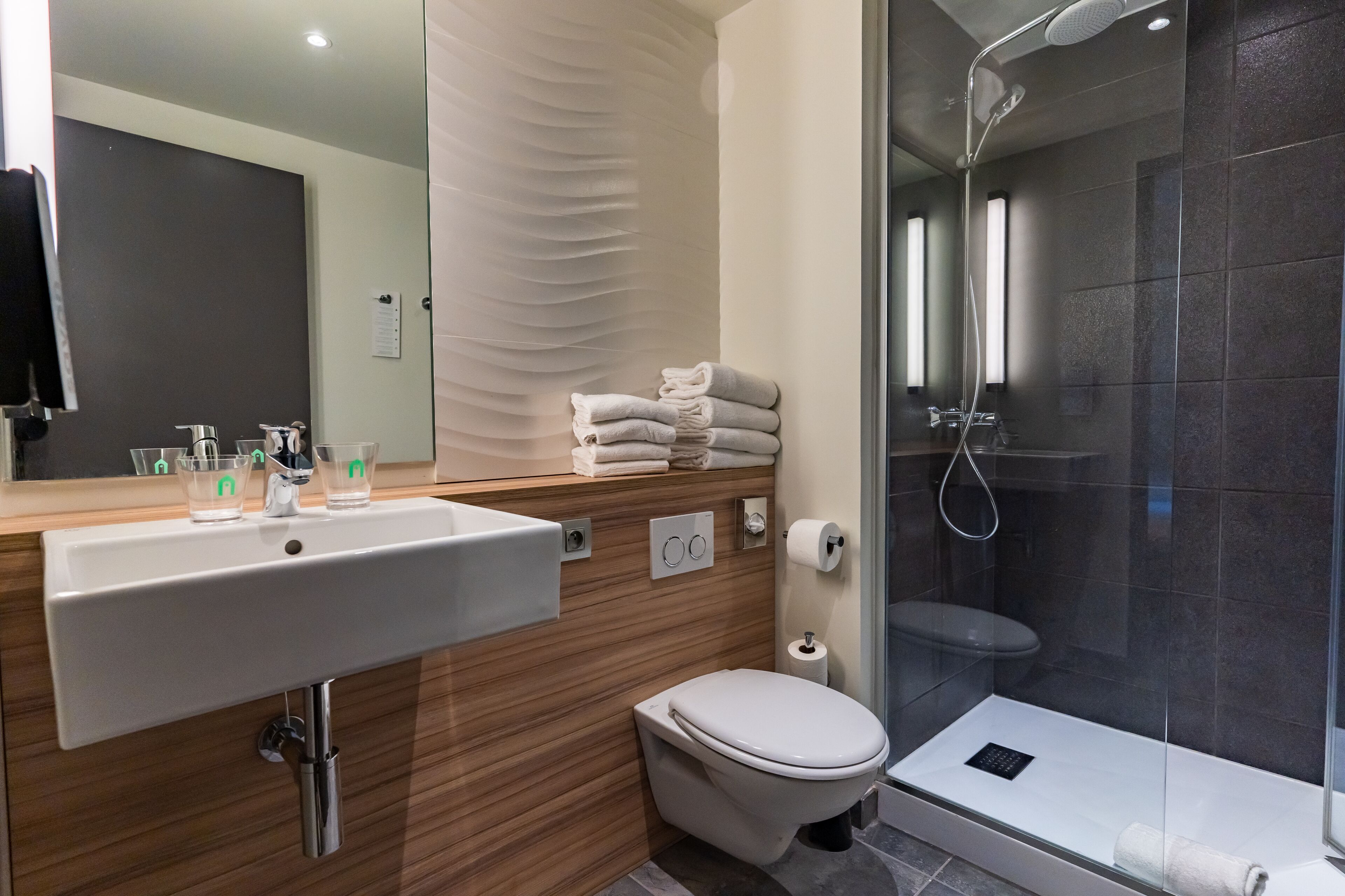 Shower, eco-friendly toiletries, hair dryer, towels