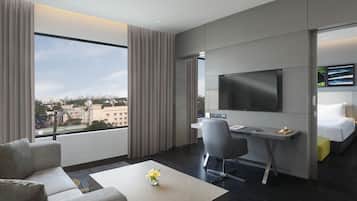 Luxury Suite with One Way Airport Transfer, Separate Living Room and Bathtub | Minibar, in-room safe, desk, blackout curtains