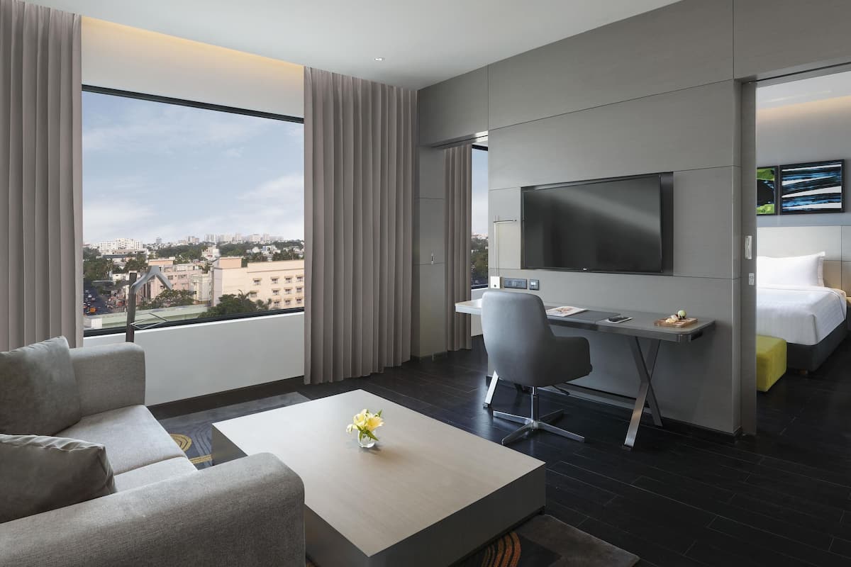 Luxury Suite with One Way Airport Transfer, Separate Living Room and Bathtub | Minibar, in-room safe, desk, blackout drapes