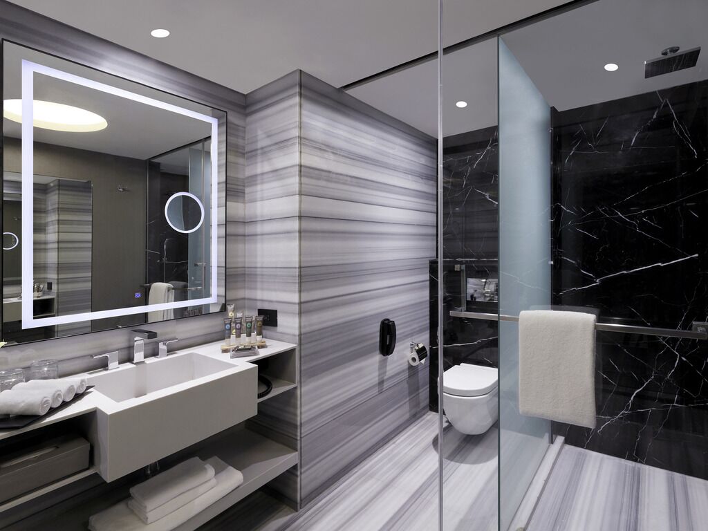 Eco-friendly toiletries, hair dryer, slippers, towels