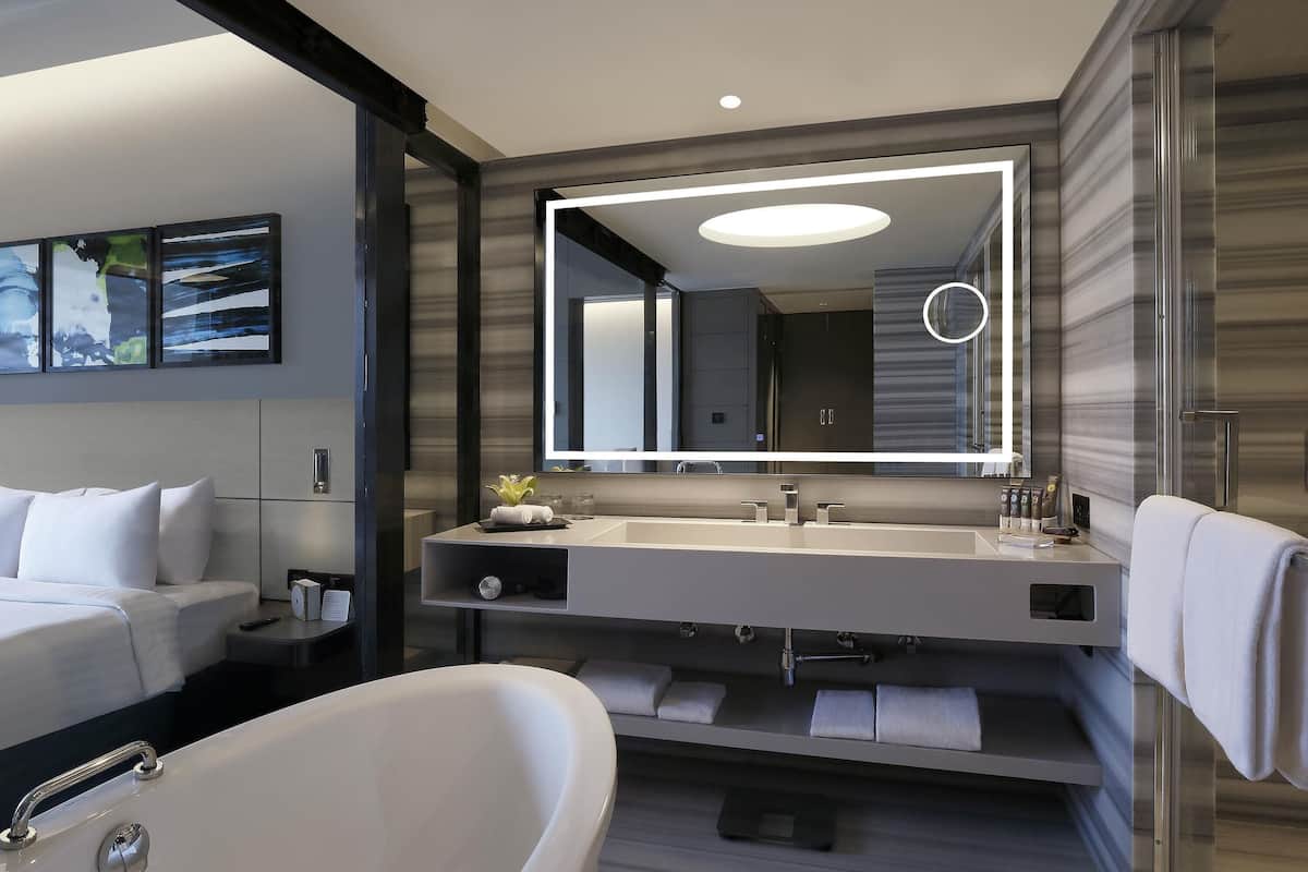 luxury suite, bathtub (separate living room) | 1 bedroom, minibar, in-room safe, desk