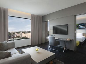 Luxury Suite with One Way Airport Transfer, Separate Living Room and Bathtub | Minibar, in-room safe, desk, blackout drapes