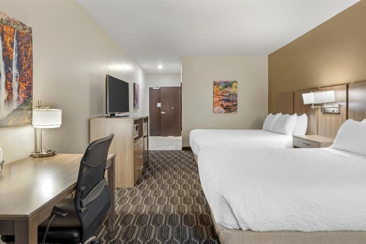 Premium bedding, desk, laptop workspace, iron/ironing board