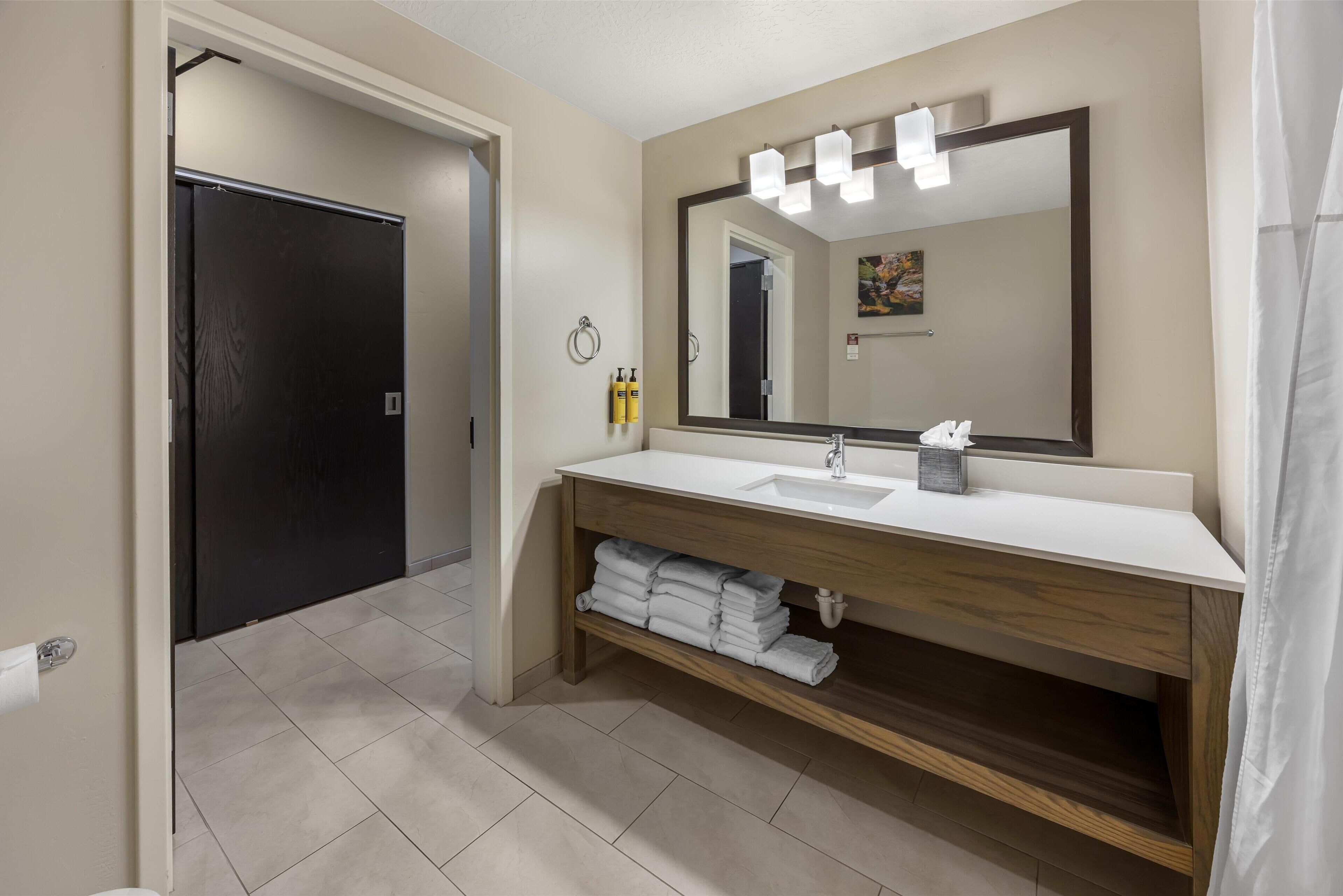 suite, 1 king bed, non smoking, refrigerator & microwave (with sofabed) | bathroom | combined shower/bathtub, free toiletries, hair dryer, towels