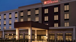 A multi-story hotel with a prominent "Hilton Garden Inn" sign, a covered entrance, and a landscaped area in front. - Hilton Garden Inn Newtown Square Radnor (Newtown Square)