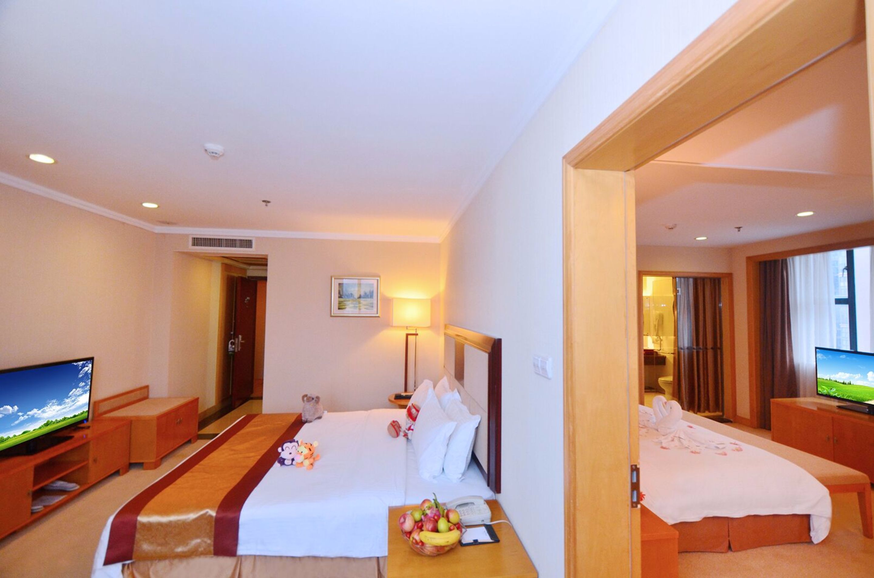 family room | in-room safe, desk, blackout curtains, iron/ironing board