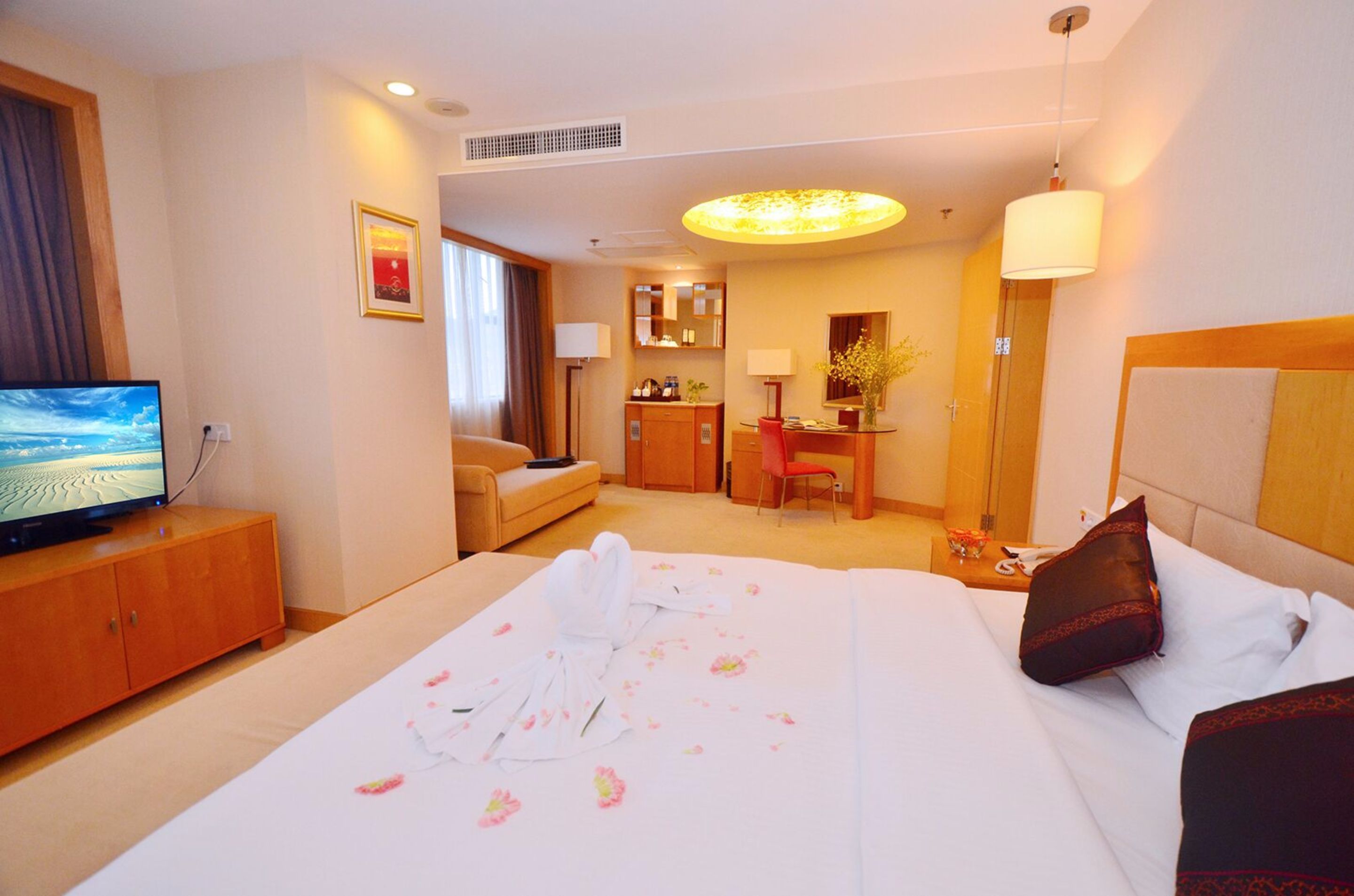 family room | in-room safe, desk, blackout curtains, iron/ironing board