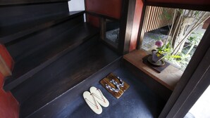 A wooden staircase leading to a room with a small window overlooking a garden. - Kamiza-an Kamanza-tei (Kyoto)