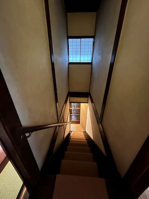 Staircase leads to a window at the top.