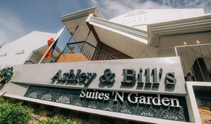 A sign for "Ashley & Billy's Suites N Garden" with a modern architectural design. - Ashley and Bill's Suites 'N Garden (Carcar)