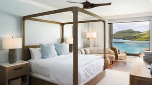 A four-poster bed with a view of the ocean. - Timbers Kauai (Lihue)