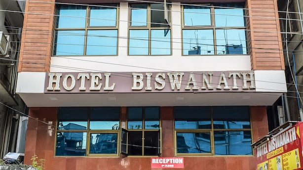 A hotel named "HOTEL BISWANATH" with a reception area and a sign indicating "RECEPTION" and "LODGING" on the ground floor. - Hotel Biswanath (Guwahati)