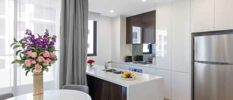 2 Bedroom Suite | Private kitchen | Full-sized fridge, microwave, oven, stovetop