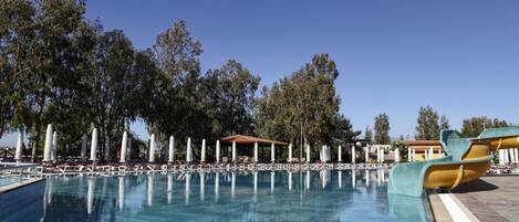 Indoor pool, outdoor pool, pool umbrellas, pool loungers