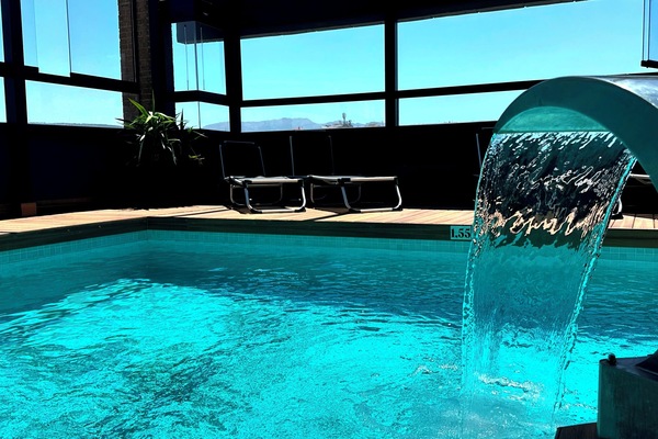 Seasonal outdoor pool, open 11:00 AM to 8:00 PM, pool umbrellas