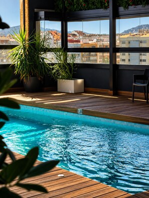 Indoor pool, open 11:00 AM to 8:00 PM, pool umbrellas, sun loungers