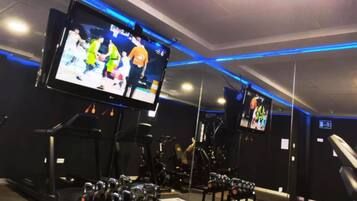 Stay active with our fully equipped gym featuring treadmills, stationary bikes, and weight machines, plus large flat-screen TVs for entertainment.