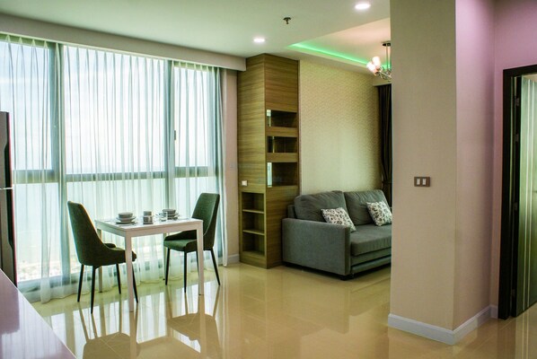 One Bedroom Apartment - 3013 | Living room | 42-inch flat-screen TV with cable channels, TV