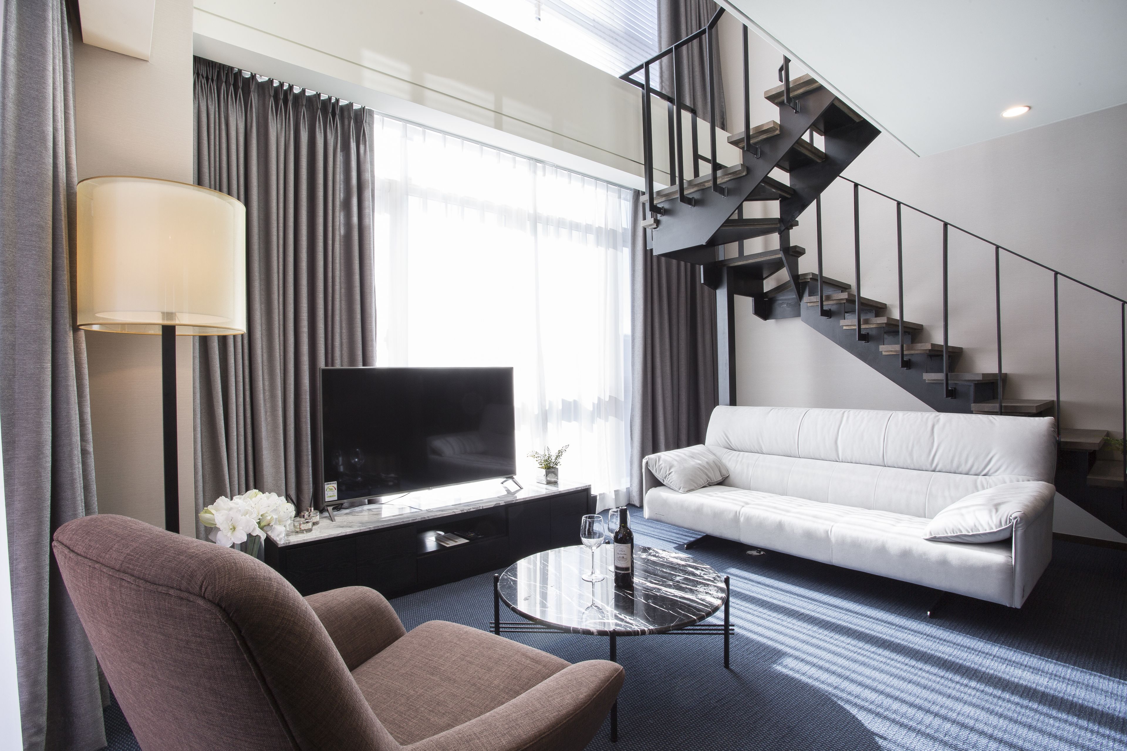 duplex suite | living area | flat-screen tv