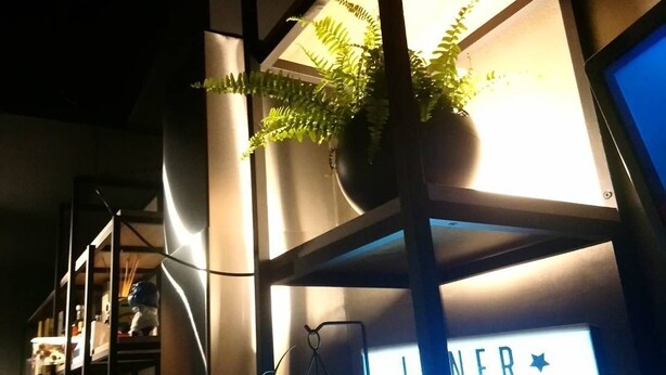 A modern interior with a sign indicating 'INNER SPACE OPEN'. - Inner Place (Tainan)