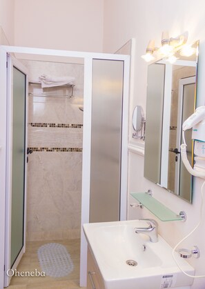 Shower, free toiletries, hair dryer, bathrobes