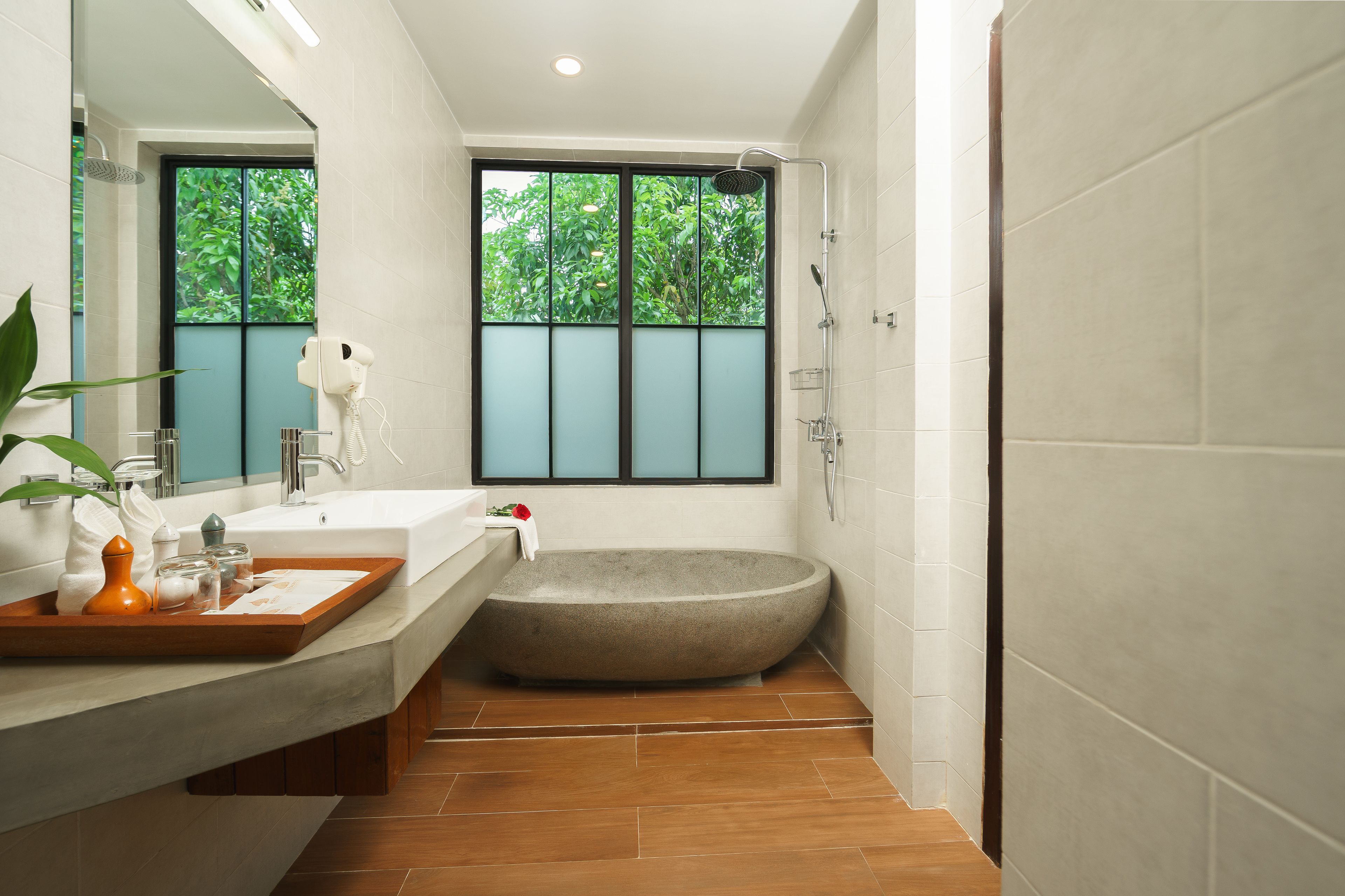 designer toiletries, hair dryer, slippers, towels