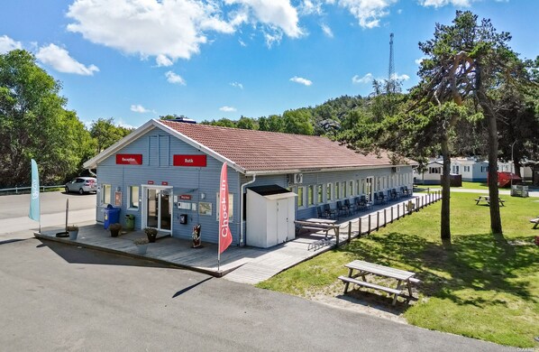 A building with a reception area, a butchery, and a check-in counter. - First Camp Lilleby (Torslanda)