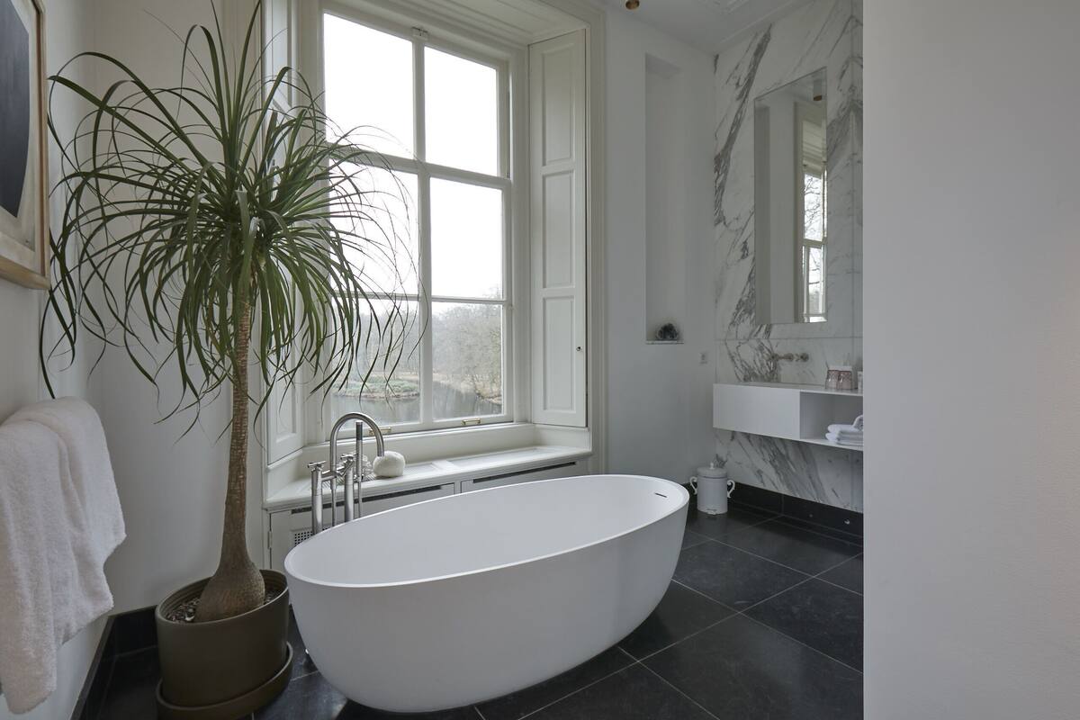 terrace suite | bathroom | rainfall showerhead, designer toiletries, hair dryer, bathrobes