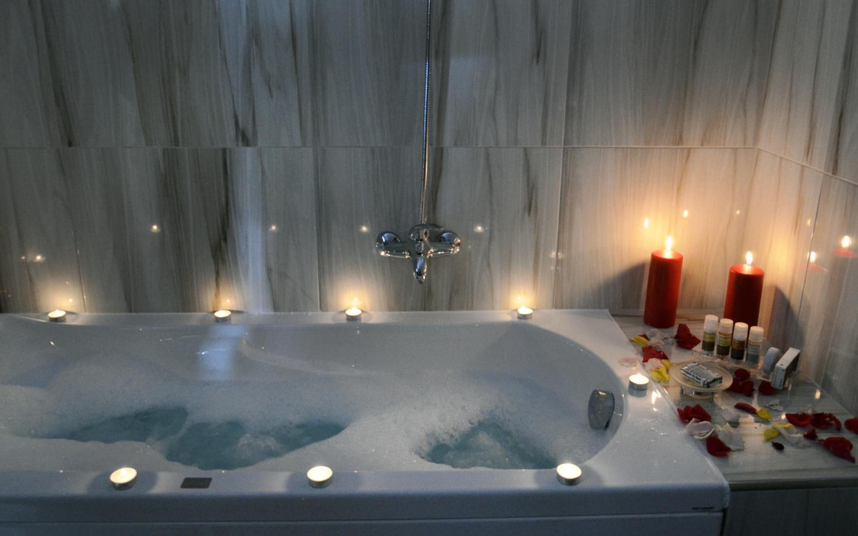 designer toiletries, hair dryer, slippers, towels