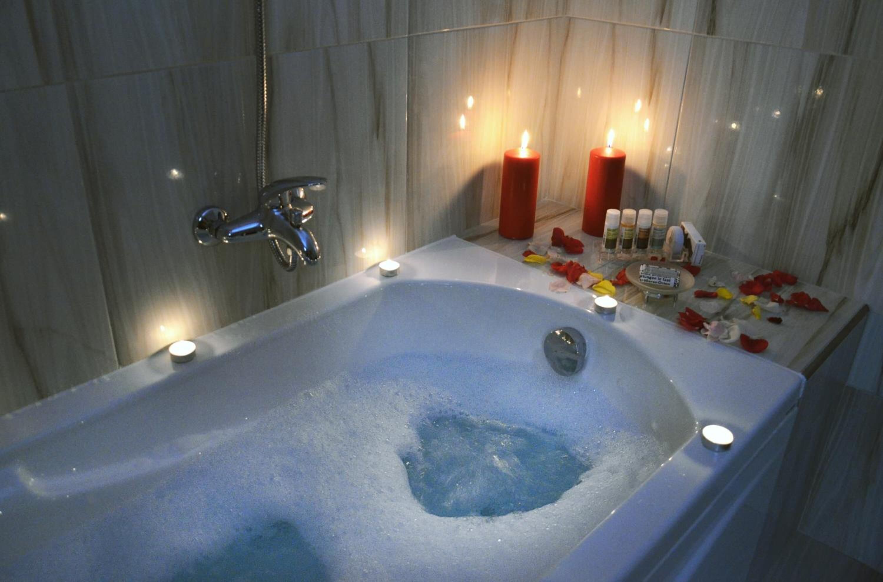 designer toiletries, hair dryer, slippers, towels